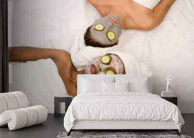 two girls are relaxing during facial mask application in spa Wall mural