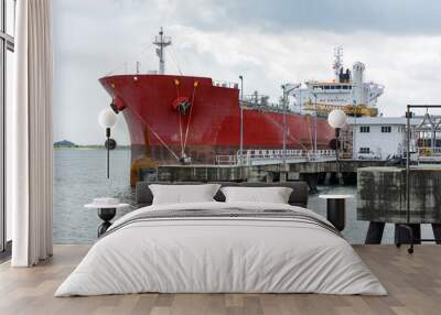 Large liquid cargo vessel docked at the jetty near Tanjung Langsat Port, Johor, Malaysia. Wall mural