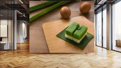 Selective focus of Kuih Seri Muka, traditional Malaysian two layered dessert with steamed glutinous rice forming the bottom half and a green custard layer made with pandan juice. Wall mural