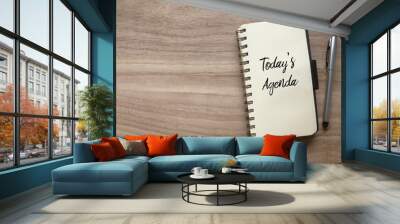 Top view of pen and notebook written with Today's Agenda on wooden background with copy space. Wall mural