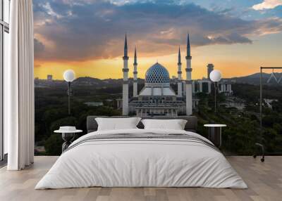 Aerial view of the Sultan Salahuddin Abdul Aziz Shah mosque with dramatic and majestic sunset as background.  Wall mural