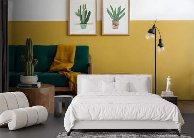 Living room with bright yellow wall and wooden floor. On the left side of the picture, there is a green sofa with a potted cactus on it. Next to the sofa, there are two wooden side tables. Wall mural