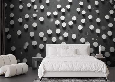 Abstract image of a repeating pattern of white circles with shadows on a dark gray background. The circles are evenly spaced and create a sense of depth and texture. Wall mural