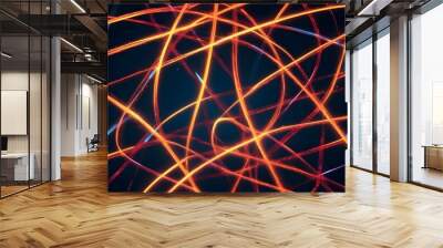 An abstract image of glowing orange and blue lines, creating a web-like pattern on a dark background. The lines are dynamic and intertwining, creating a sense of energy and movement. Wall mural