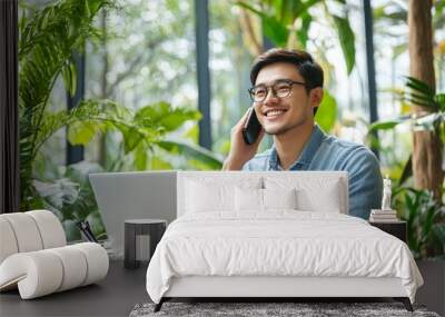 Smiling Man Talking on Phone in a Green Office Wall mural