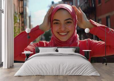 Smiling Young Woman in Red Hijab and Jacket Wall mural