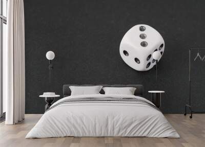 a dice over black surface Wall mural