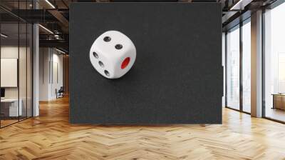 a dice over black surface Wall mural