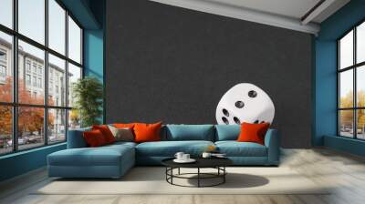 a dice over black surface Wall mural