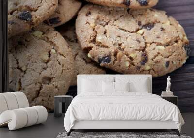 Chocolate chips and hazelnuts over white background Wall mural