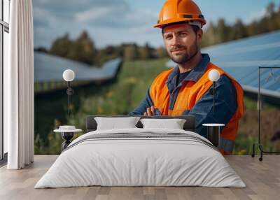 Portrait of a worker standing in front of a solar panel Wall mural