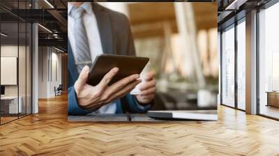 businessman working with digital tablet and laptop with financial business strategy at a coffee shop cafe Wall mural