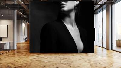 Sexy elegant black and white portrait of young beautiful woman in black deep v neck jacket and dark sunglasses Wall mural