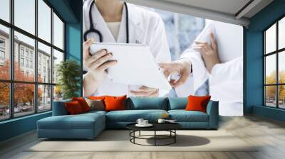 Doctor of two people to consult with the tablet Wall mural