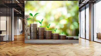 Wood blocks SAVE and money coins stack with tree on top, idea for newplan, new cocept for money, keep money for family and hope on light bokeh background. Wall mural