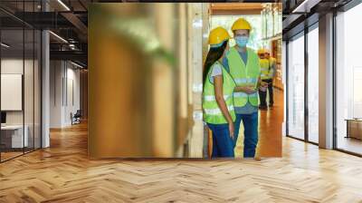 factory warehouse workers wearing face mask at work Wall mural