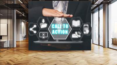 Call to action concept, Person hand holding digital tablet with call to action icon on virtual screen. Wall mural