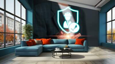 Illustration of work safety concept featuring a glowing shield with a worker icon and checkmark, emphasizing occupational health and safety. Wall mural