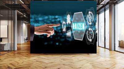 Kaizen concept, Business woman hand touching kaizen icon on virtual screen with blue bokeh background. Wall mural