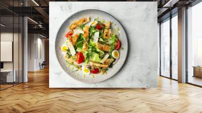 French salad Nicoise with tuna, egg, green beans, tomatoes, olives, lettuce, onions and anchovies on a white background. Healthy food Wall mural