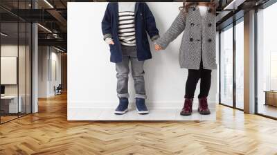 Group of preschool kids wearing autumn clothes. Children Friendship Togetherness. Child clothing, foot wear and fashion. Wall mural