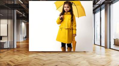 brunette child with umbrella; isolated kid in yellow raincoat and rain boots holding yellow parasol; concept of health and protection during bad weather; white background Wall mural