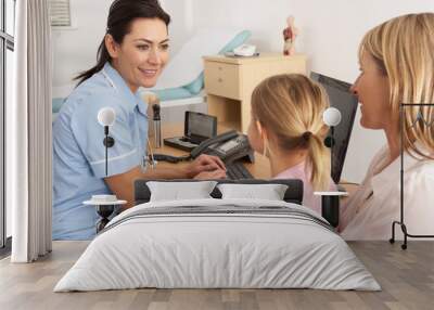 british nurse talking to young child and mother Wall mural