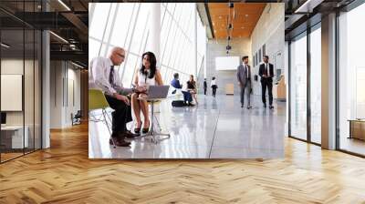 business meetings in busy office foyer area Wall mural