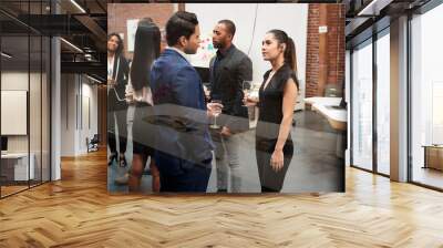 Business Team Socializing At After Works Drinks In Modern Office Wall mural