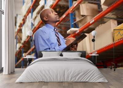 Businessman With Clipboard In Warehouse Wall mural