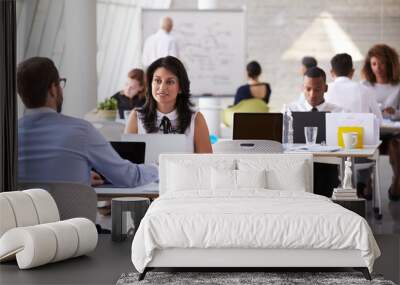 businesspeople working at desks in modern office Wall mural