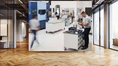 Busy Engineering Workshop With Workers Using CNC Machinery Wall mural