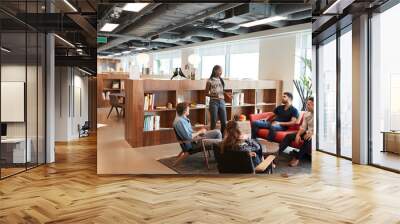 Casually Dressed Businessmen And Businesswomen Having Informal Meeting In Modern Office Wall mural