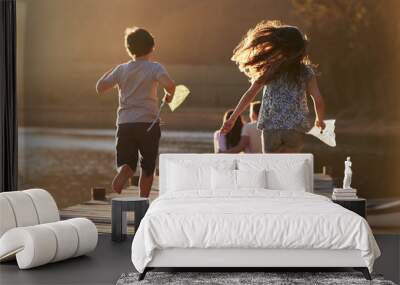 Children Run Towards Parents On Wooden Jetty By Lake Wall mural