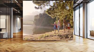 Children Walk By Lake With Parents On Family Hiking Adventure Wall mural