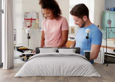 Couple Preparing Batch Of Healthy Meals At Home In Kitchen Together Wall mural