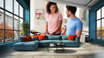 Couple Preparing Batch Of Healthy Meals At Home In Kitchen Together Wall mural