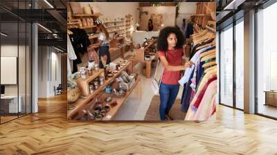 Customers Browsing In Independent Clothing And Gift Store Wall mural