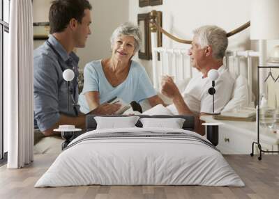 Doctor On Home Visit Discussing Health Of Senior Male Patient With Wife Wall mural