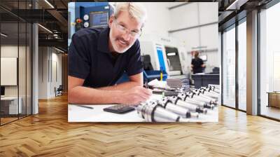 Engineer Planning Project With CNC Machinery In Background Wall mural