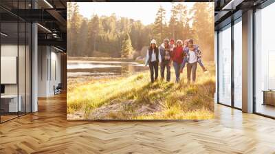 Extended Family Group Walking By Lake Wall mural