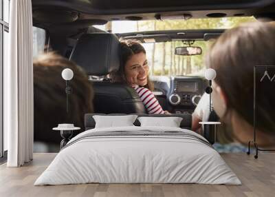 Family Driving In Open Top Car On Countryside Road Trip Wall mural