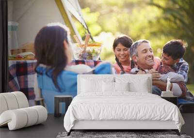 Family Enjoying Camping Holiday In Countryside Wall mural