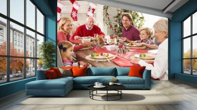 Family With Grandparents Enjoying Christmas Meal At Table Wall mural