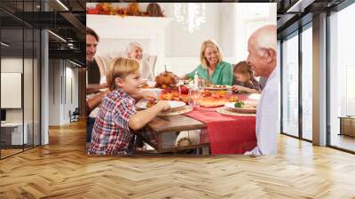 Family With Grandparents Enjoying Thanksgiving Meal At Table Wall mural