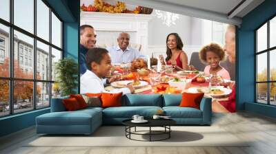 Family With Grandparents Enjoying Thanksgiving Meal At Table Wall mural