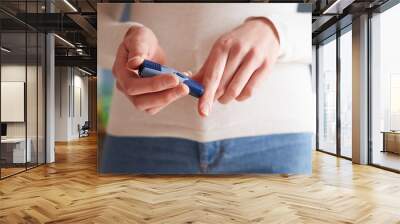 Female Diabetic Checking Blood Sugar Levels Wall mural