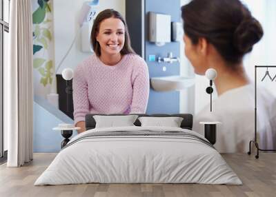 Female Patient And Doctor Have Consultation In Hospital Room Wall mural