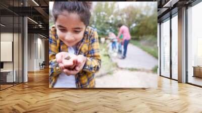 Girl Holding Small Frog As Group Of Children On Outdoor Activity Camp Catch And Study Pond Life Wall mural