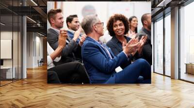 Group Of Businessmen And Businesswomen Applauding Presentation At Conference Wall mural